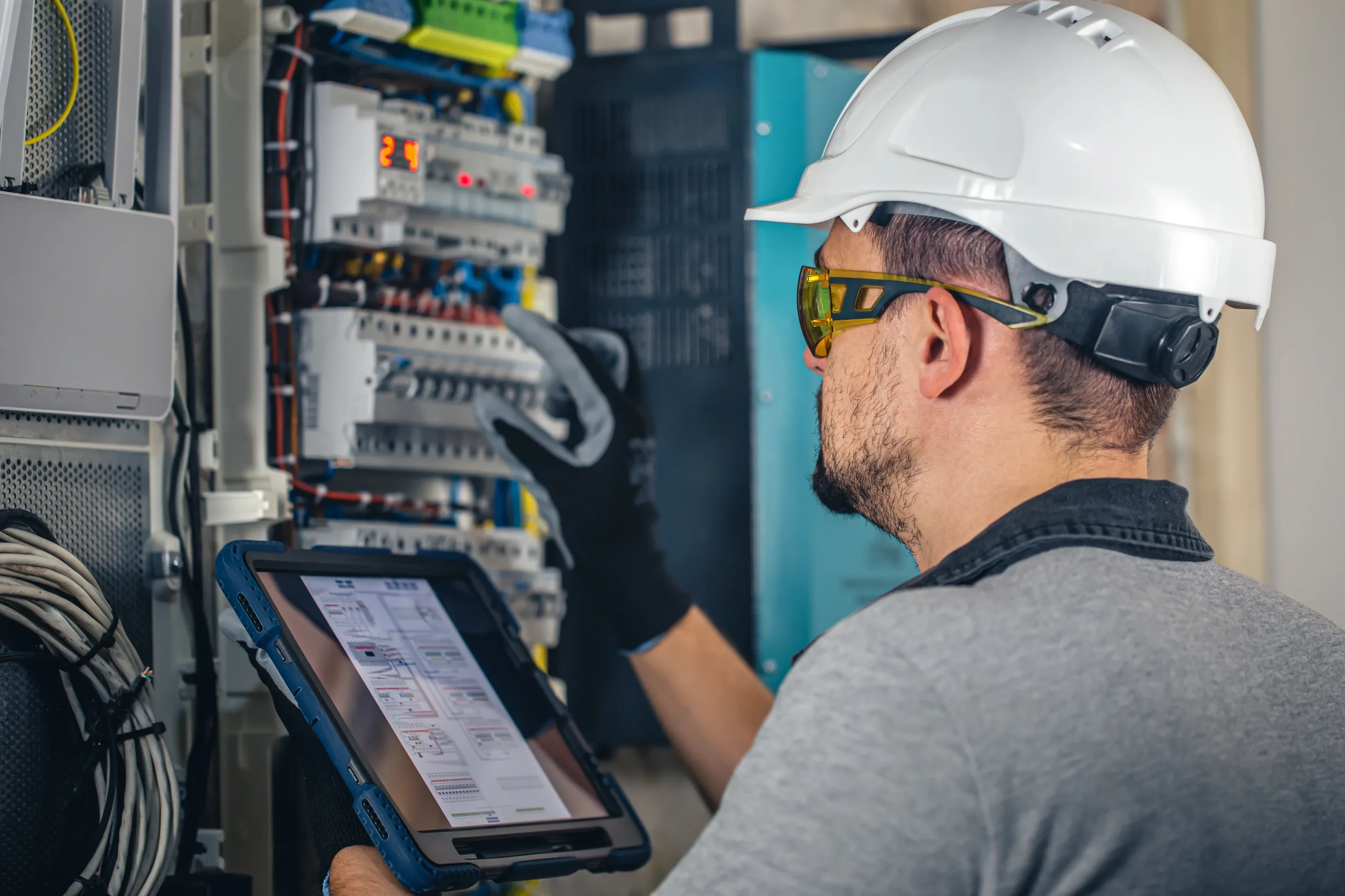 Technician testing building automation controls